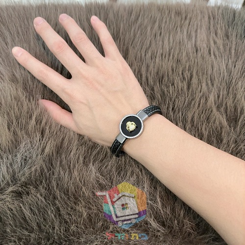 Cartier Armband aus Leder mit Pantherkopf auf schwarzem Medaillon